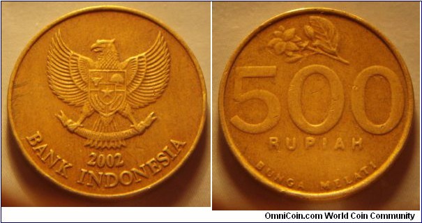 Indonesia | 
500 Rupiah, 2002 | 
24 mm, 5.32 gr. | 
Aluminium-bronze | 

Obverse: National Coat of Arms, date below | 
Lettering: 2002 BANK INDONESIA |  

Reverse: Jasmine flower, denomination below | 
Lettering: 500 RUPIAH BUNGA MELATI |