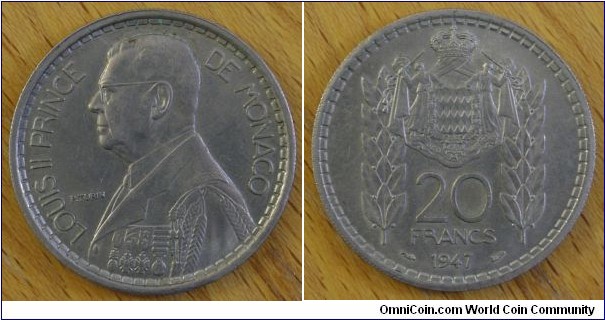 Monaco | 
20 Francs, 1947 | 
30 mm, 10 gr. | 
Copper-nickel | 

Obverse: Prince Louis II facing left | 
Lettering: LOUIS II PRINCE DE MONACO P. TURIN | 

Reverse: National Coat of Arms, denomination below, date bottom | 
Lettering: 20 FRANCS 1947 |