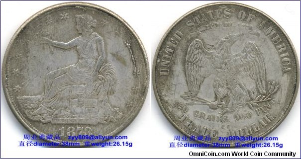 1873 United States Silver Trade Dollar Coin, Obverse: 1873- seated Liberty with a laurel in the right hand and a bunch of wheat behind. Reverse: UNITED STATES OF AMERICA, 420 GRAINS. 900 FINE. TRADE DOLLAR- Eagle with its head facing right and wings open, standing on arrows and a laurel sprig