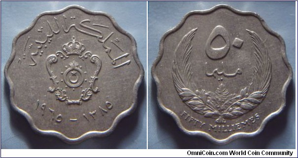 Kingdom of Libya | 
50 Millièmes, 1965 (1385) | 
26 mm, 7 gr. | 
Copper-nickel | 

Obverse: National Coat of Arms, date below | 
Lettering: المملكة الليبية ١٩٦٥–١٣٨٥ | 

Reverse: Denomination within wreath | 
Lettering: ٥٠ مليما FIFTY MILLIÈMES |