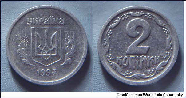 Ukraine | 
2 Kopiyky, 1993 | 
17.3 mm, 0.64 gr. | 
Aluminium | 

Obverse: National Coat of Arms, date below | 
Lettering: україна 1993 |

Reverse: Denomination | 
Lettering: 2 копійки |