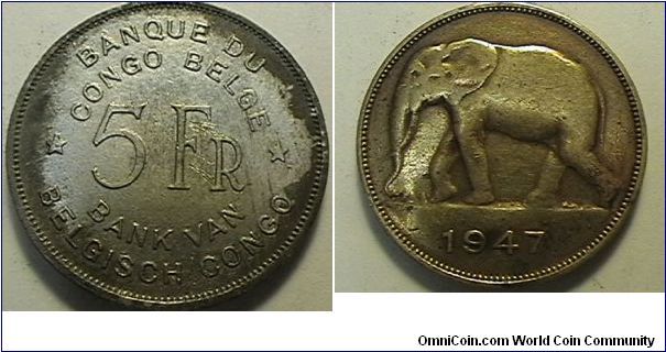 Belgian Congo, 5 Francs, Brass. this coin was covered with sodder which I was able to removed without damage to the coin.