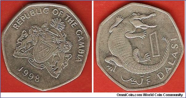 1 dalasi
slender-snouted crocodile
designer reverse Michael Rizzello
copper-nickel 
7-sided coin