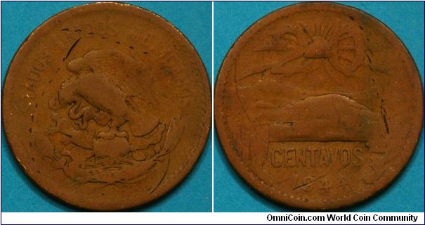 20 Centavos, 28 mm, bronze.  Looks like they kept same pattern on this coin for a long time (see my 1968 example)