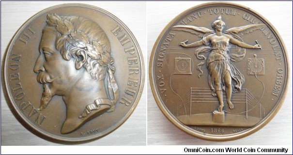 1866 France Napoleon III Electronic Telegraph Medal by A. Bovy. Bronze 72MM.
Obv: Laureate bust left within inscription. Rev: Personification of Electric Telegraphy as a winged Victory draped in antique. Behind her the entire telegraphic system.
