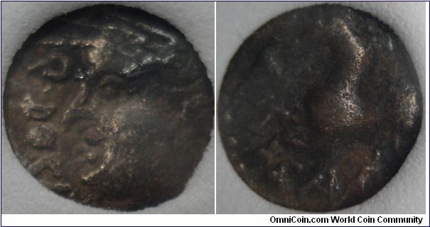 silver quinarius of the Sequani tribe from the Besancon area of France. This small coin minted circa 65 -50 bc. Obverse legend Q(uintus) Doci(os). Reverse Sam F(ilius). Helmete bust of Q Doci ?/ galloping horse