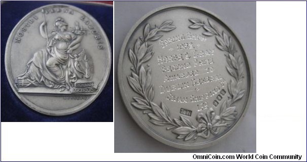 1930 Ireland Royal Dublin Society Medal by William Mossop. Silver: 46MM./44.8 gm.
Obv: Hibemia seated with spear. NOSTRI PLENA LABORIS. Abundance from Our Labor. Rev: Prize insciption for Dublin Spring Show 1932 Horse & Dray Second Prize with full hallmarks.
