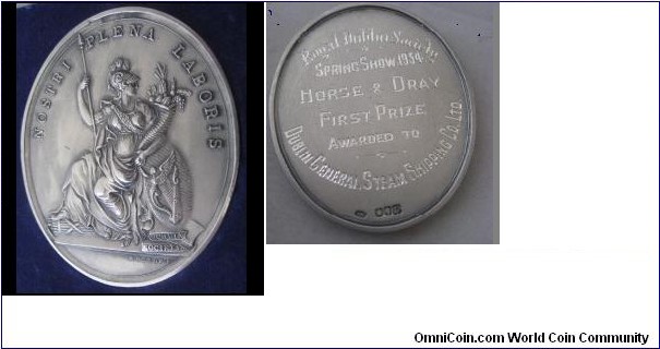 1936 Ireland Royal Dublin Society Oval Medal by William Mossop. Silver: 57X46MM./ 62.8 gm.
Obv: Hibemia seated with spear. NOSTRI PLENA LABORIS. Abundance from Our Labor. Rev: Prize insciption for Dublin Spring Show 1954 Horse & Dray First Prize with full hallmarks.

