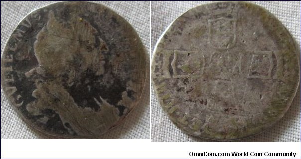 1696 sixpence, very warn and battered