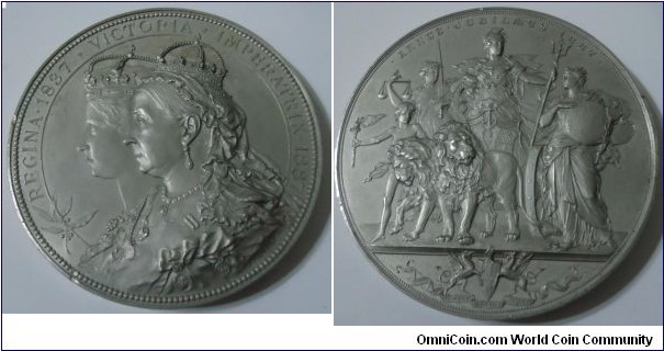 1887 UK Golden Jubilee of the Reign of Queen Victoria Medal by Anton Schariff. WM: 80MM./316.8gm.
Obv: Conjoined, young and old, busts of Queen Victoria left. Rev: Britannia standing in a car drawn by two lions flanked by Justice and Wisdom