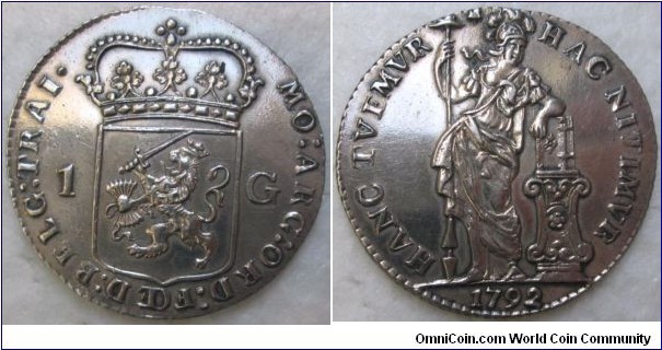 1792 Dutch, Utrecht, West Indies 1 Gulden. Silver: 31.1MM./10.58 gms.
Obv: Standing Pallas with liberty hat on spear face right , learning on bible that is standing on an altar. HANC.TVEMVR HAC NITIMVR/1794. Rev: Crowned arms of Utrecht between 1 and G : MO: ARG: ORD: FOED: BELG: TRAL./1 GL/W. 
