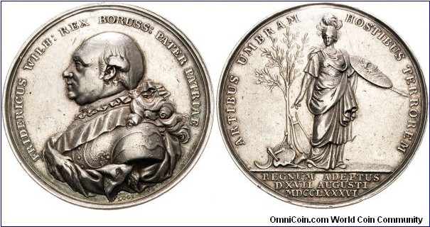 1786 German Brandenburg-Prussia Frederich William II 1786-1797 Medal by Loos. (darn hole)  Silver: 42.1MM.
Obv: On his accession to the throne. Bust in armor left. Rev: Minerva standing with shield and spear beside olive with objects of art, sincence & commerce.
