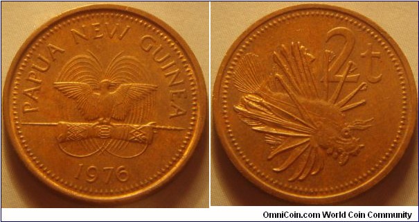 Papua New Guinea | 
2 Toea, 1976 | 
21.72 mm, 4.15 gr. | 
Copper plated zinc | 

Obverse: National Coat of Arms, date below | 
Lettering: PAPUA NEW GUINEA 1975 | 

Reverse: Lion fish facing right, denomination below | 
Lettering: 2t |