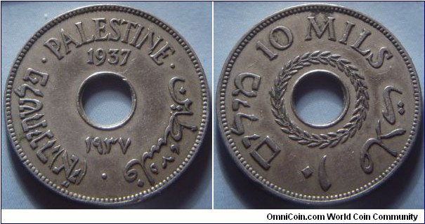 Palestine | 
10 Mils, 1937 | 
27 mm, 6.3 gr. | 
Copper-nickel | 

Obverse: Date above and below centre hole, legend | 
Lettering: פלשתינה (א