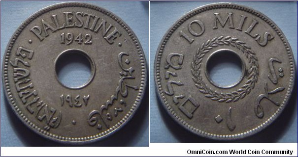 Palestine | 
10 Mils, 1942 | 
27 mm, 6.3 gr. | 
Copper-nickel | 

Obverse: Date above and below centre hole, legend | 
Lettering: פלשתינה (א