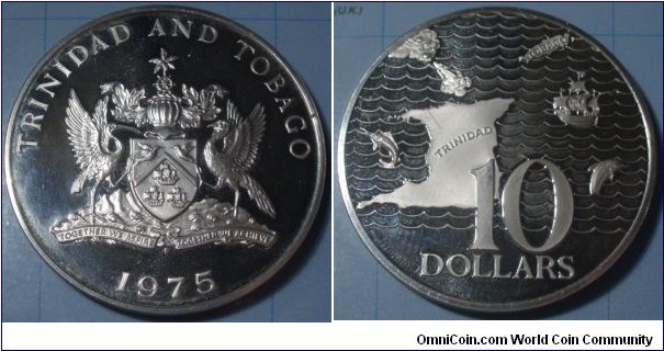 Trinidad & Tobago | 
10 Dollars, 1975 | 
42 mm, 35 gr. | 
Silver (.925) | 

Obverse: National Coat of Arms, date below | 
Lettering: TRINIDAD AND TOBAGO 1975 | 

Reverse: Map of Trinidad and Tobago, fish and ship, denomination below | 
Lettering: 10 DOLLARS |