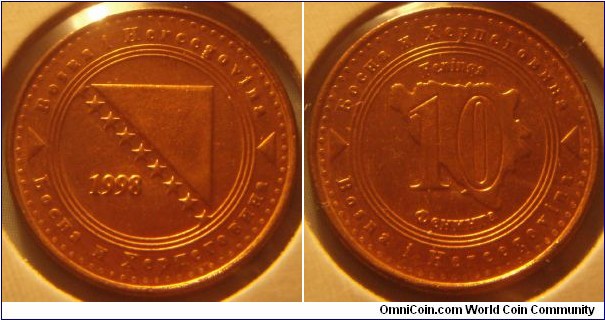 Bosnia and Herzegovina | 
10 Feninga, 1998 | 
20mm, 3.9 gr. | 
Copper plated Steel |

Obverse: National Coat of Arms, date left | 
Lettering:  Bosna i Hercegovina   Босна и Херцговина 1998 | 

Reverse: Denomination on Map of Bosnia | 
Lettering:  Bosna i Hercegovina   Feninga 10 Фенинга Босна и Херцговина |