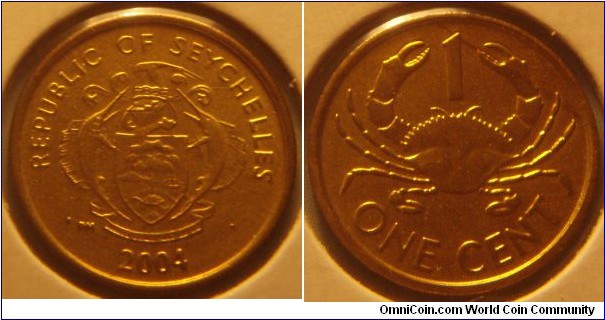 Seychelles |
1 Cent, 2004 |   
16.03 mm, 1.3 gr. | 
Brass | 

Obverse: National Coat of Arms, date below | 
Lettering: REPUBLIC OF SEYCHELLES • 1990 • | 

Reverse: Mud Crab, denomination below | 
Lettering: ONE CENT |