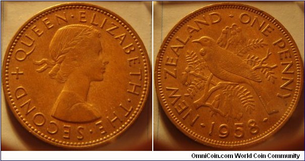 New Zealand |
1 Penny, 1958 |
31 mm, 9.6 gr. |
Bronze |

Obverse: Queen Elizabeth II facing right |
Lettering: + QUEEN • ELIZABETH • THE • SECOND |

Reverse: A Tui bird on branch facing left, denomination right, date below |
Lettering: • NEW ZEALAND • ONE PENNY • 1958 |