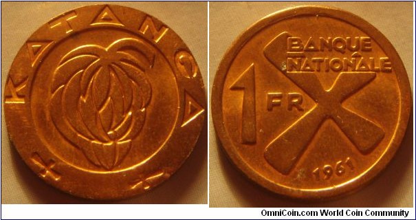 Katanga |
1 Franc, 1961 |
22 mm, 5 gr. |
Bronze |

Obverse: Bunch of bananas |
Lettering: KATANGA |

Reverse: Denomination left, date below. The cross symbolizes iron bars |
Lettering: BANQUE NATIONALE 1 FR 1961 |