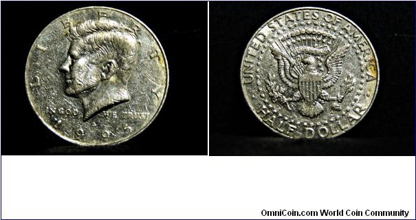 1995 Kennedy Half Dollar
(Mint Mark D)
VALUE: 50 cents
EDGE: reeded
COMPOSITION: outer layer of 75% copper, 25% nickel surrounding core of 100% copper
YEARS OF MINTING: 1964-present
OBVERSE DESIGN: Left portrait of John F Kennedy
DESIGNER: Gilroy Roberts 1964
REVERSE DESIGN: modified presidential seal
DESIGNER: Frank Gasparro 1964