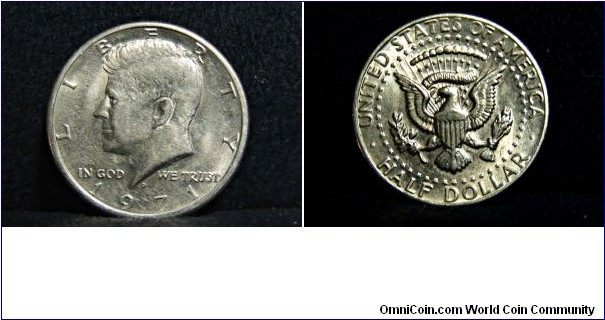 1971 Kennedy Half Dollar (Mint Mark D) VALUE: 50 cents EDGE: reeded COMPOSITION: outer layer of 75% copper, 25% nickel surrounding core of 100% copper YEARS OF MINTING: 1964-present OBVERSE DESIGN: Left portrait of John F Kennedy DESIGNER: Gilroy Roberts 1964 REVERSE DESIGN: modified presidential seal DESIGNER: Frank Gasparro 1964