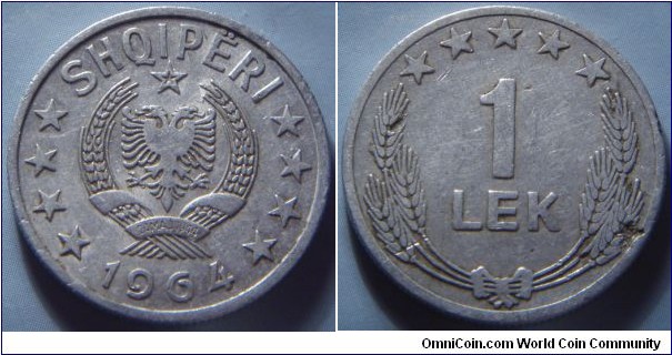 Albania | 
1 Lek, 1964 | 
26.5 mm, 2.3 gr | 
Aluminium | 

Obverse: National Coat of Arms, date below |
Lettering: SHQIPËRI 1964 | 

Reverse: Denomination surrounded by ears of wheat and five stars | 
Lettering: 1 LEK |