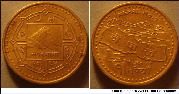 Nepal | 
1 Rupee, 2007 (2064) | 
19.95 mm, 3.94 gr. | 
Brass plated Steel | 

Obverse: Mount Everest in central square, date below | 
Lettering: सगरमाथा २०६४| 

Reverse: Map of Nepal with mountains, denomination below | 
Lettering: NEPAL Re.1 नेपाल १ रूपैयाँ|