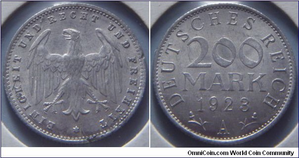 Weimar Republic | 
200 Mark, 1923 A | 
20 mm, 3.3 gr. | 
Bronze | 

Obverse: Heraldic eagle | 
Lettering: EINIGKEIT UND RECHT UND FREIHEIT * | 

Reverse: Denomination, date below, mint letter bottom | 
Lettering: DEUTSCHES REICH 200 MARK 1923 A |