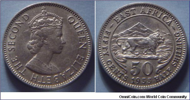 East Africa | 
50 Cents, 1955 | 
21 mm, 4 gr. | 
Copper-nickel | 

Obverse: Queen Elizabeth II facing right | 
Lettering: QUEEN ELIZABETH THE SECOND | 

Reverse: A lion facing right, mountain in background, denomination below | 
Lettering: ¬– EAST AFRICA – 50 FIFTY CENTS 1955 HALF SHILLING |