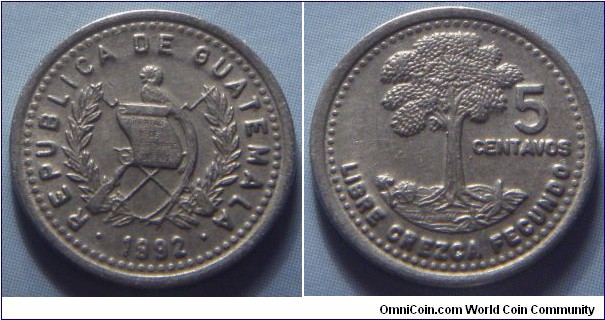 Guatemala | 
5 Centavos, 1992 | 
16 mm, 1.6 gr. | 
Copper-nickel-zinc | 

Obverse: National Coat of Arms, date below | 
Lettering: • REPUBLICA DE GUATEMALA • 1992 | 

Reverse: Kapok tree, denomination right | 
Lettering: LIBRE CREZCA FECUNDO 5 CENTAVOS |