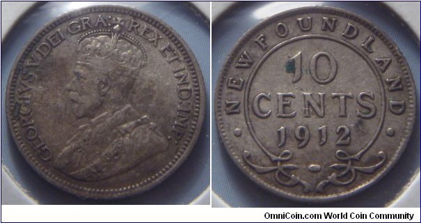 Newfoundland | 
10 Cents, 1912 | 
18 mm, 2.36 gr. | 
Silver (.925) | 

Obverse: King George V facing left | 
Lettering: GEORGIVS V DEI GRA: REX ET IND:IMP: | 

Reverse: Denomination, date below | 
Lettering: • NEWFOUNDLAND • 10 CENTS 1912 |