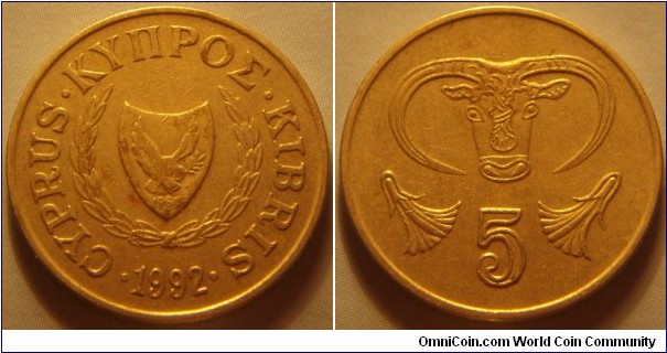 Cyprus |
5 Sent, 1992 | 
22 mm, 3.8 gr. | 
Copper-nickel | 

Obverse: National Coat of Arms with the independence year 1960, date below | 
Lettering: • CYPRUS • ΚΥΠΡΟΣ • KIBRIS • 1992| 

Reverse: Bull's head and two flowers, denomination below | 
Lettering: 5 |