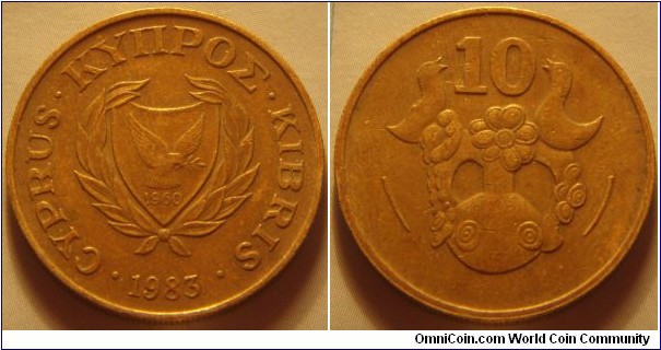 Cyprus |
10 Sent, 1983 | 
25 mm, 5.5 gr. | 
Nickel-brass | 

Obverse: National Coat of Arms with the independence year 1960, date below | 
Lettering: • CYPRUS • ΚΥΠΡΟΣ • KIBRIS • 1983| 

Reverse: Modern clay vase of Phini depicting flowers and birds, denomination above | 
Lettering: 10 |