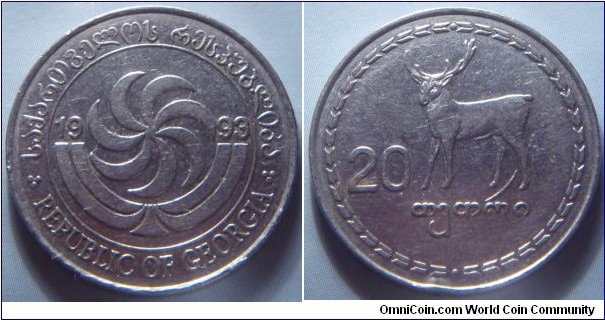 Georgia | 
20 Tetri, 1993 | 
25 mm, 4.95 gr. | 
Stainless Steel | 

Obverse: Borjgali, a Georgian symbol of the Sun with seven rotating wings, over the Christian Tree of Life divide date | 
Lettering: საქართველოს რესპუბლიკა REPUBLIC OF GEORGIA 1993| 

Reverse: Red deer facing left, denomination below | 
Lettering: 20 თეთრი |