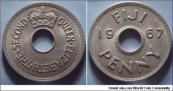 Fiji | 
1 Penny, 1967 | 
26 mm, 6.64 gr. | 
Copper-nickel | 

Obverse: Crown above centre hole | 
Lettering: QUEEN•ELIZABETH•THE•SECOND | 

Reverse: Centre hole divides date, denomination below | 
Lettering: FIJI 1967 PENNY |