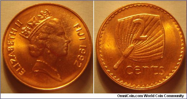 Fiji | 
2 Cents, 1992 | 
21.1 mm, 3.1 gr. | 
Copper plated Zinc | 

Obverse: Queen Elizabeth facing right, date right | 
Lettering: ELIZABETH II FIJI 1992 | 

Reverse: Palm fan, denomination | 
Lettering: 2 cents |