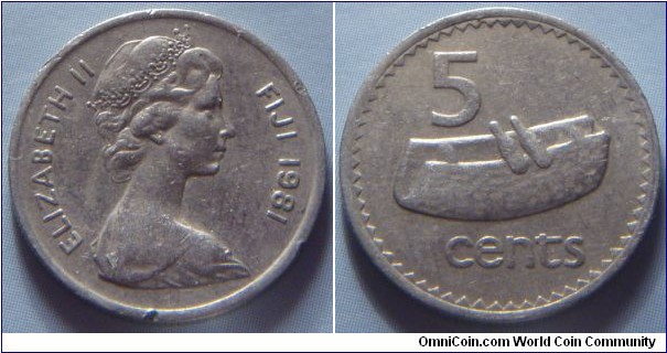 Fiji | 
5 Cents, 1981 | 
19.35 mm, 2.8 gr. | 
Copper-nickel | 

Obverse: Queen Elizabeth facing right, date right | 
Lettering: ELIZABETH II FIJI 1981 | 

Reverse: Fijian drum (lali), denomination | 
Lettering: 5 cents |