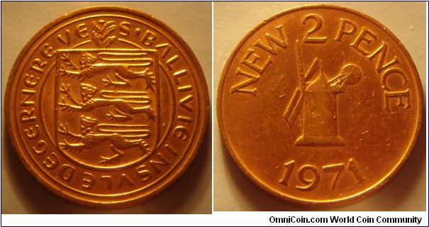 Guernsey | 
2 New Pence, 1971 | 
25.91 mm, 7.12 gr. | 
Bronze | 

Obverse: National Coat of Arms | 
Lettering: S'BALLVIE INSVLE DEGERNERE VE | 

Reverse: Windmill from Sark, denomination above, date below | 
Lettering: NEW 2 PENCE 1971 |