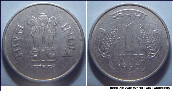 India | 
1 Rupee, 1997 | 
25 mm, 4.85 gr. | 
Stainless Steel | 

Obverse: Ashoka Lion Capitol | 
Lettering: भारत INDIA सत्यमेव जयते | 

Reverse: Denomination, date below | 
Lettering: रुपया 1 RUPEE 1997 |