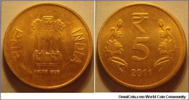 India | 
5 Rupees, 2011 | 
23 mm, 6 gr. | 
Nickel-brass | 

Obverse: Ashoka Lion Capitol, date below | 
Lettering: भारत INDIA रूपये सत्यमेव जयते 2010 | 

Reverse: Denomination, date below | 
Lettering: ₹ 5 2011 |