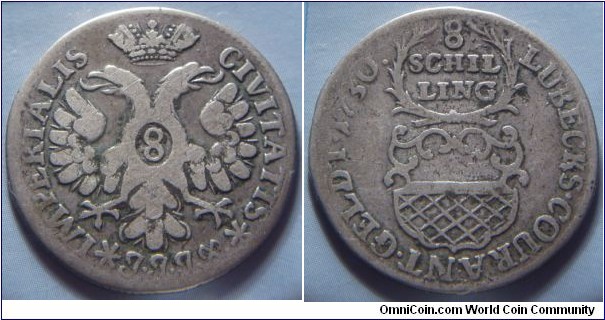Lübeck | 
8 Schilling, 1730 | 
28 mm, 5.5 gr. | 
Silver (.625) | 

Obverse: Crowned eagle | 
Lettering: IMPERIALIS CIVITATIS *J.J.J.* 8 | 

Reverse: Coat of Arms, date left, denomination above| 
Lettering: LUBECKS•COURANT•GELDT•1730. 8 SCHILLING |