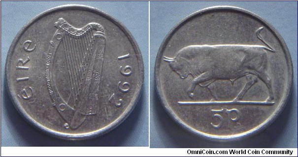 Ireland | 
5 Pingin, 1992 – small type | 
18.5 mm, 3.25 gr. | 
Copper-nickel | 

Obverse: Irish harp (Cláirseach), date right|
Lettering: éire 1992 | 

Reverse: Bull facing left, denomination below | 
Lettering: 5P |