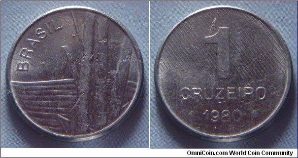 Brazil | 
1 Cruzeiro novo, 1980 | 
20 mm, 3.2 gr. | 
Stainless Steel | 

Obverse: Sugar canes | 
Lettering: BRASIL | 

Reverse: Ribbon behind denomination, date below | 
Lettering: 1 CRUZEIRO 1980 |