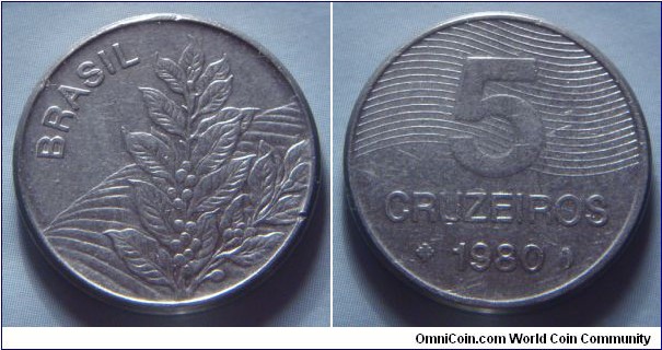 Brazil | 
5 Cruzeiros novo, 1980 | 
21.8 mm, 4.48 gr. | 
Stainless Steel | 

Obverse: Coffee plant | 
Lettering: BRASIL | 

Reverse: Ribbon behind denomination, date below | 
Lettering: 5 CRUZEIROS 1980 |