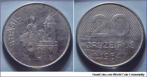 Brazil | 
20 Cruzeiros novo, 1984 | 
26 mm, 6.33 gr. | 
Stainless Steel | 

Obverse: Church of Saint Francis of Assis | 
Lettering: BRASIL | 

Reverse: Ribbon behind denomination, date below | 
Lettering: 20 CRUZEIROS 1984 |