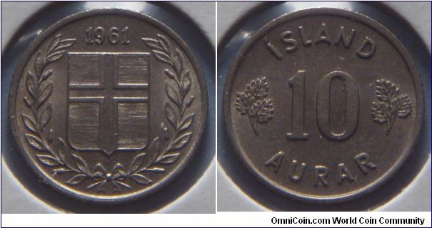 Iceland | 
10 Aurar, 1961 | 
15 mm, 1.6 gr. | 
Copper-nickel | 

Obverse: Flag of Iceland in shield within laurel wreath, date above |
Lettering: 1961 | 

Reverse: Denomination | 
Lettering: ÍSLAND 10 AURAR |