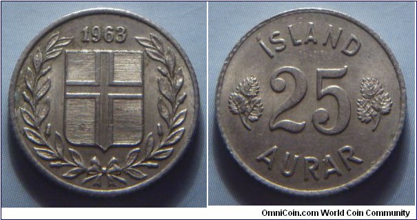 Iceland | 
25 Aurar, 1963 | 
17 mm, 2.44 gr. | 
Copper-nickel | 

Obverse: Flag of Iceland in shield within laurel wreath, date above |
Lettering: 1963 | 

Reverse: Denomination | 
Lettering: ÍSLAND 25 AURAR |