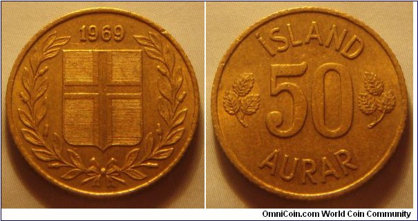 Iceland | 
50 Aurar, 1969 | 
19 mm, 2.4 gr. | 
Nickel-brass | 

Obverse: Flag of Iceland in shield within laurel wreath, date above |
Lettering: 1969 | 

Reverse: Denomination | 
Lettering: ÍSLAND 50 AURAR |