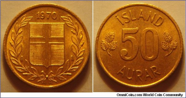 Iceland | 
50 Aurar, 1970 | 
19 mm, 2.4 gr. | 
Nickel-brass | 

Obverse: Flag of Iceland in shield within laurel wreath, date above |
Lettering: 1970 | 

Reverse: Denomination | 
Lettering: ÍSLAND 50 AURAR |